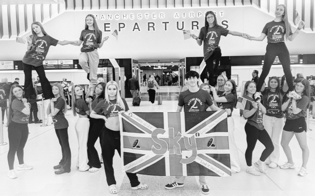 Limitless Allstars cheerleading team performing in competition uniforms, representing at a world championship level with a group stunt formation